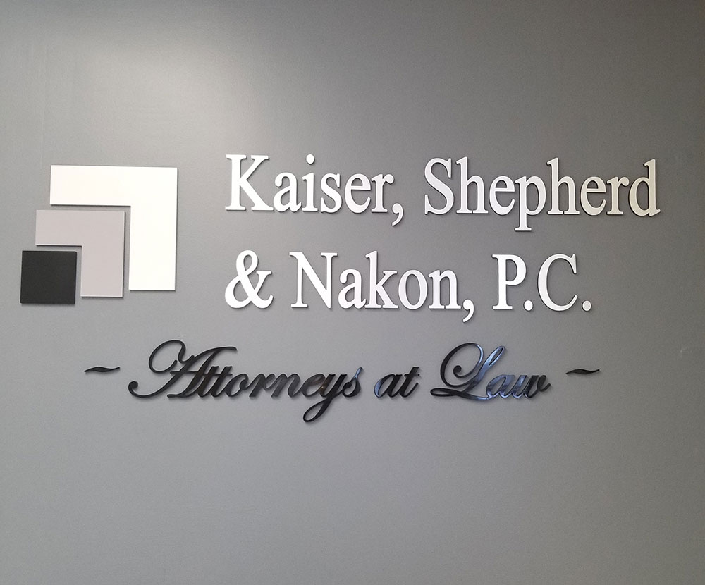 Kaiser, Shepherd & Nakon, P.C. sign on a wall.