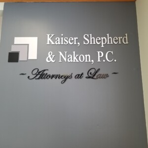 Kaiser, Shepherd & Nakon, P.C. sign on the wall.