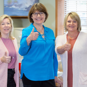 Kaiser, Shepherd & Nakon, P.C. staff holding their thumbs up.